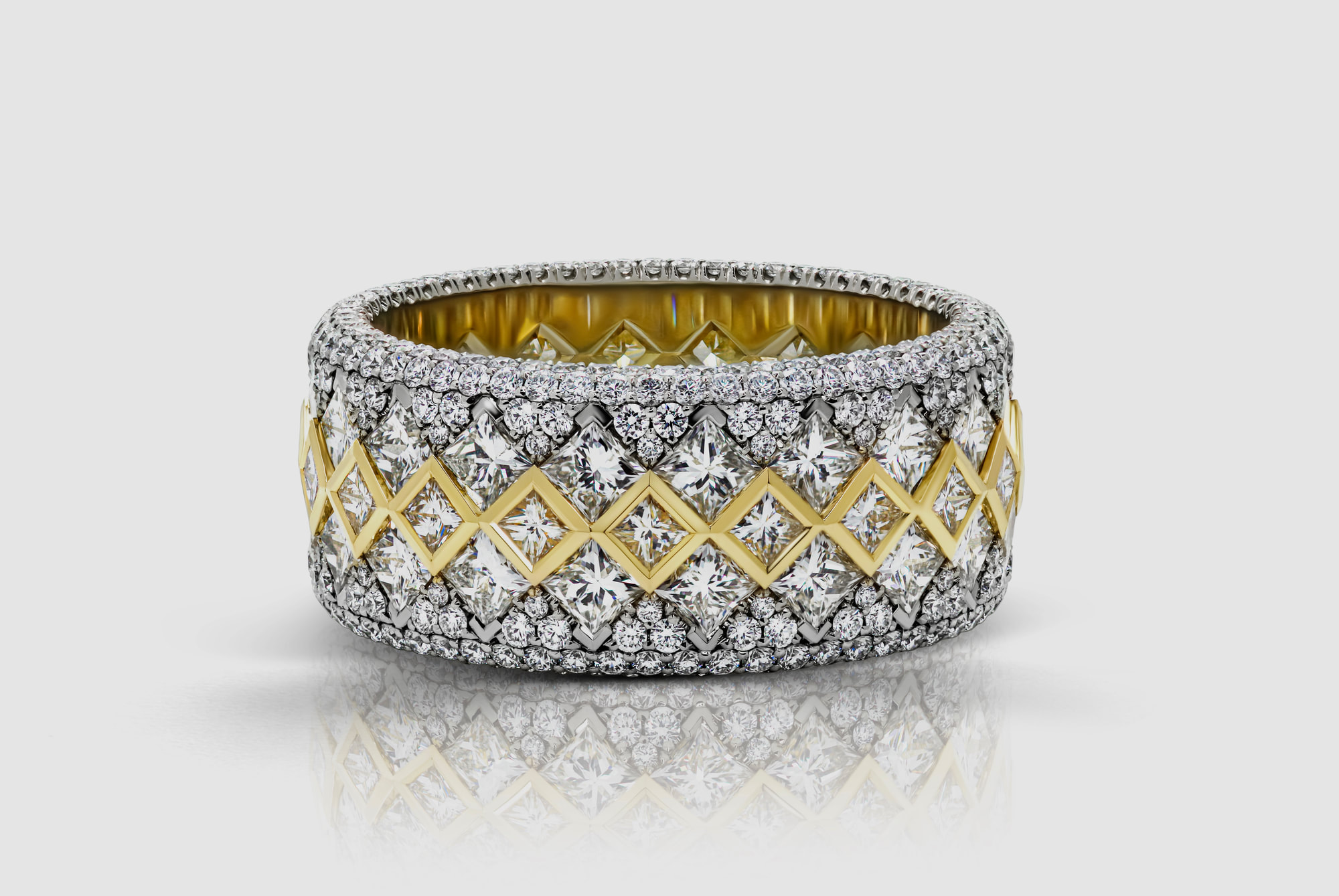 A wide-band diamond eternity ring in yellow and white gold — a signature M.C. Jeweller Originals piece